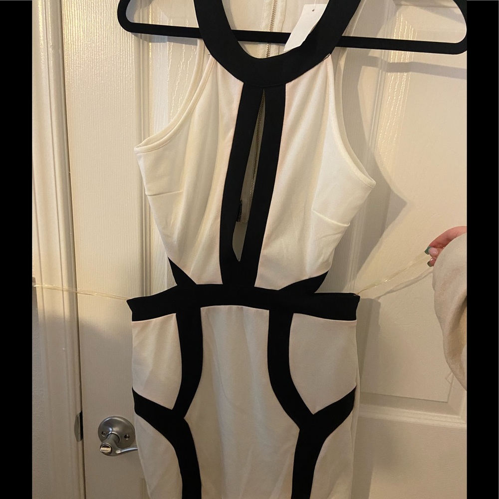 White mini dress with cut out waist and backless. Club Dress Cocktail